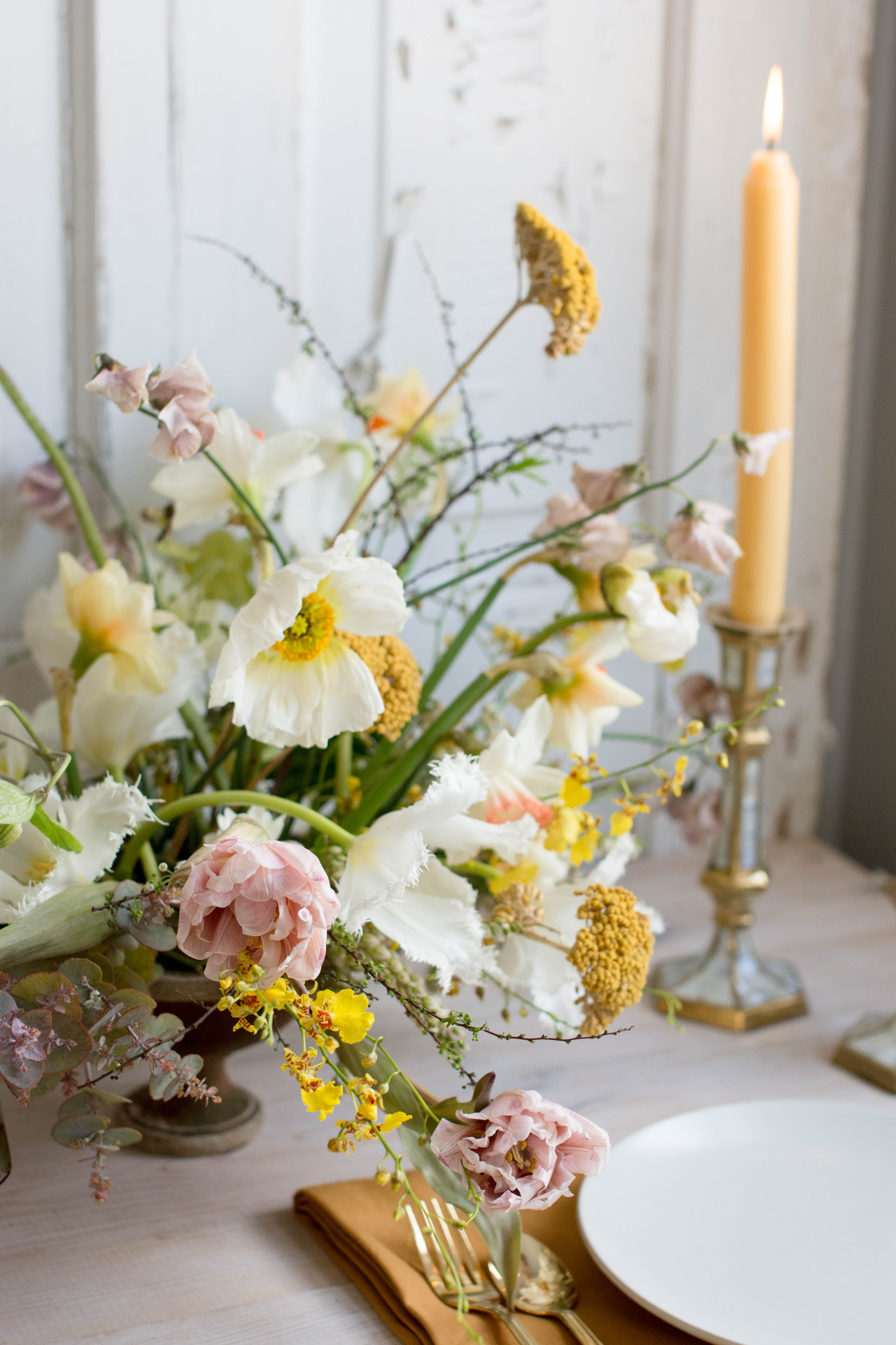 Yellow poppy centerepice for spring wedding flowers